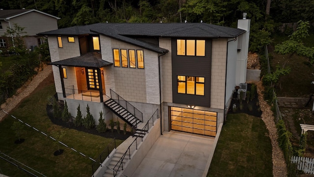 1608 Knickerbocker Ave, Chattanooga, TN 37405 - contemporary home with an attached garage, concrete driveway, a chimney, and a shingled roof