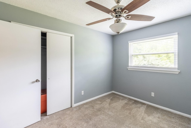 2524 Lyons Ln, Soddy Daisy, TN 37379 - unfurnished bedroom featuring carpet flooring, a closet, baseboards, ceiling fan, and a textured ceiling