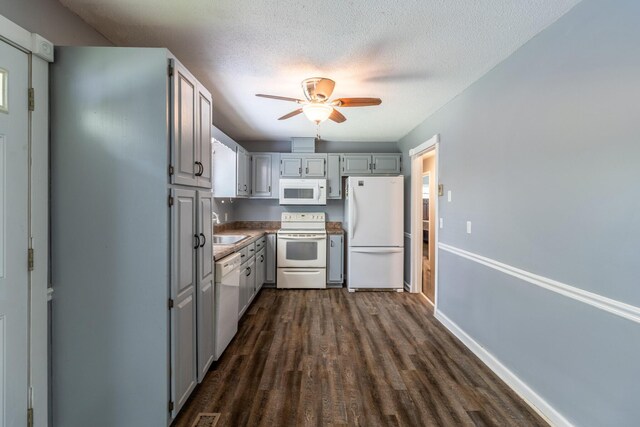 2524 Lyons Ln, Soddy Daisy, TN 37379 - kitchen featuring white appliances, dark wood-style floors, ceiling fan, a sink, and gray cabinetry
