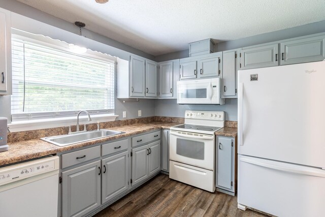 2524 Lyons Ln, Soddy Daisy, TN 37379 - kitchen featuring white appliances, a sink, dark wood finished floors, and a textured ceiling
