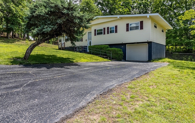 2524 Lyons Ln, Soddy Daisy, TN 37379 - view of front of property featuring asphalt driveway and an attached garage