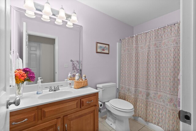 full bath with tile patterned flooring, toilet, and vanity