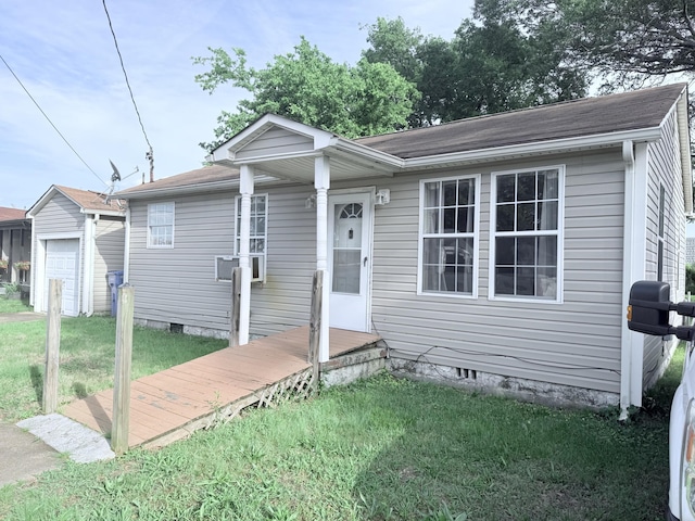 5518 Miller Dr, Chattanooga, TN 37411 - view of front of home featuring a front lawn, an outbuilding, and a shingled roof