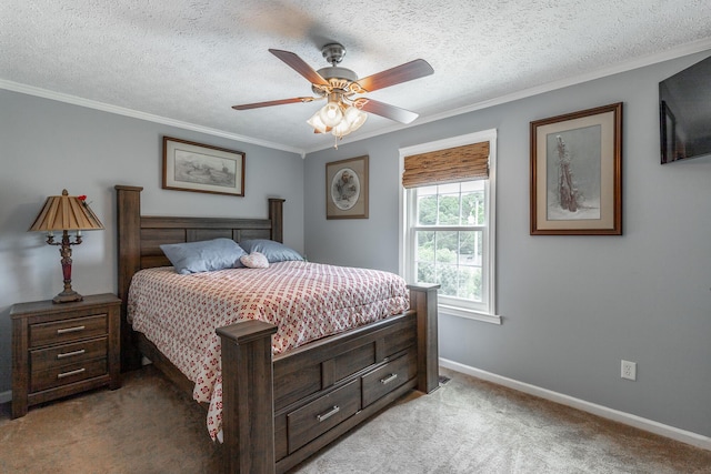 bedroom featuring light colored carpet, crown molding, baseboards, a ceiling fan, and a textured ceiling