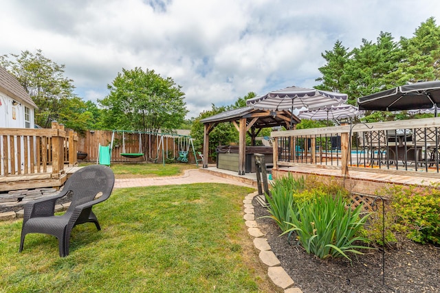 view of yard featuring a gazebo and a playground
