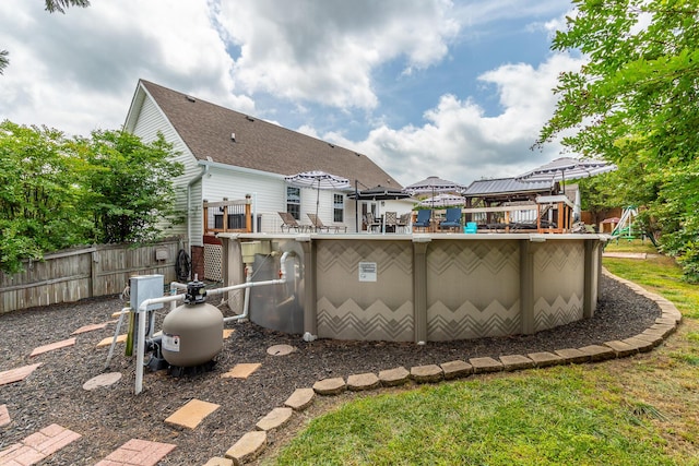 rear view of property with fence