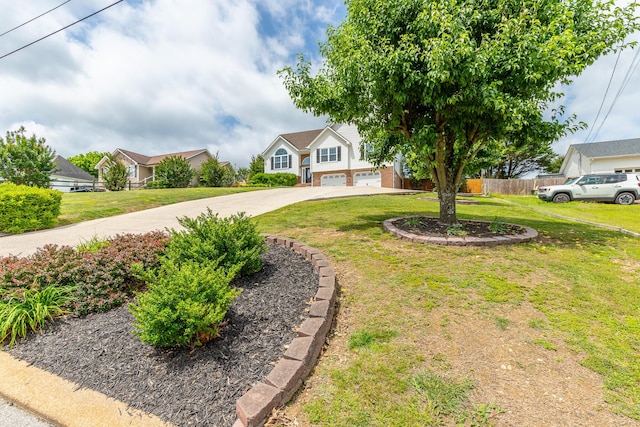 view of front of home with concrete driveway and a residential view