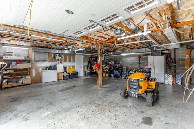 garage with a garage door opener, refrigerator, white fridge with ice dispenser, and concrete block wall