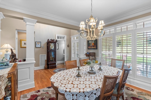 362 Windmill Ln, Georgetown, TN 37336 - dining space featuring ornamental molding, decorative columns, a chandelier, light wood-style flooring, and baseboards