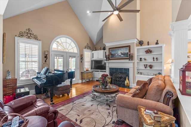 362 Windmill Ln, Georgetown, TN 37336 - living area with a ceiling fan, wood finished floors, high vaulted ceiling, a fireplace, and ornate columns
