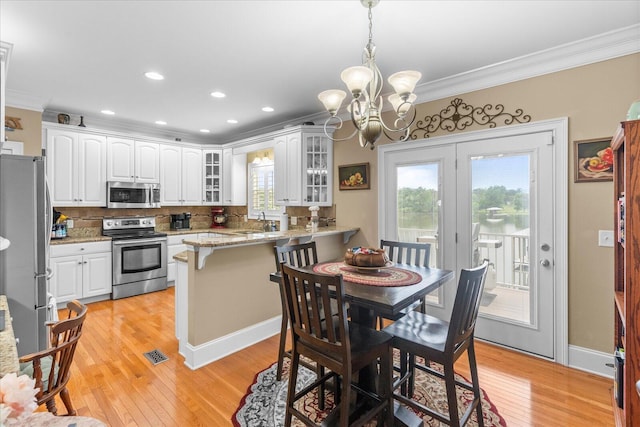 362 Windmill Ln, Georgetown, TN 37336 - dining area featuring ornamental molding, a chandelier, healthy amount of natural light, light wood-style flooring, and recessed lighting