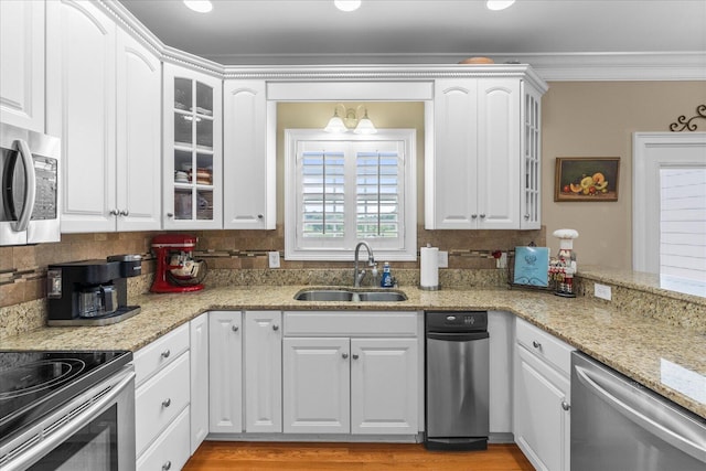 362 Windmill Ln, Georgetown, TN 37336 - kitchen with stainless steel appliances, a sink, ornamental molding, glass insert cabinets, and white cabinetry