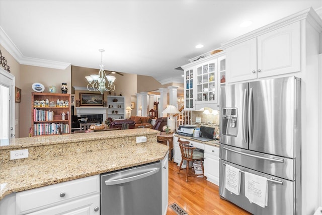 362 Windmill Ln, Georgetown, TN 37336 - kitchen with appliances with stainless steel finishes, crown molding, a chandelier, backsplash, and white cabinets