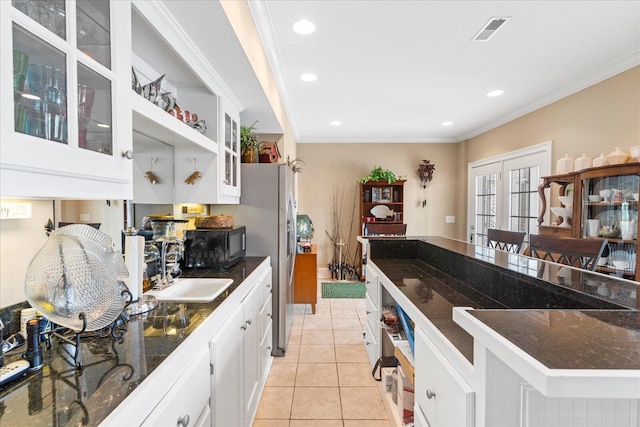 362 Windmill Ln, Georgetown, TN 37336 - kitchen featuring white cabinets, glass insert cabinets, black microwave, light tile patterned flooring, and a sink