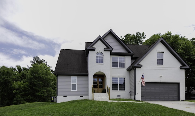 5611 Caney Ridge Cir, Ooltewah, TN 37363 - traditional-style house with an attached garage, a front lawn, crawl space, and driveway