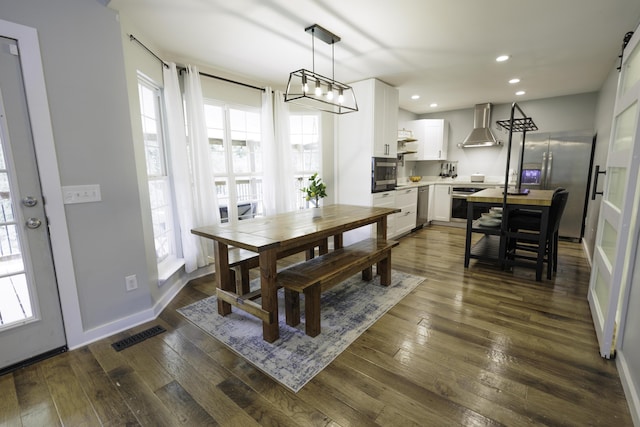5611 Caney Ridge Cir, Ooltewah, TN 37363 - dining space with dark wood finished floors, recessed lighting, and baseboards