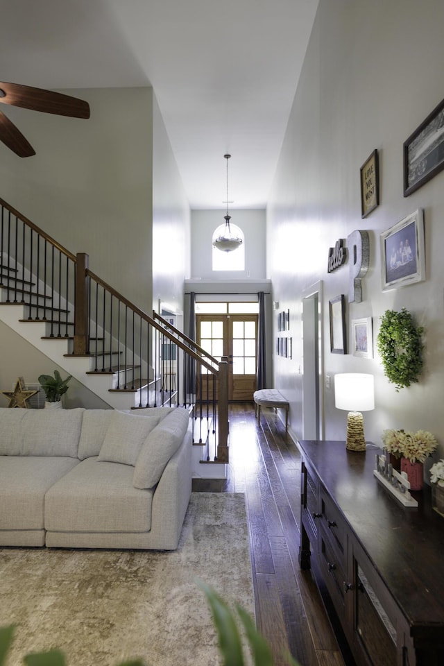 5611 Caney Ridge Cir, Ooltewah, TN 37363 - living area featuring a high ceiling, stairway, dark wood finished floors, and ceiling fan
