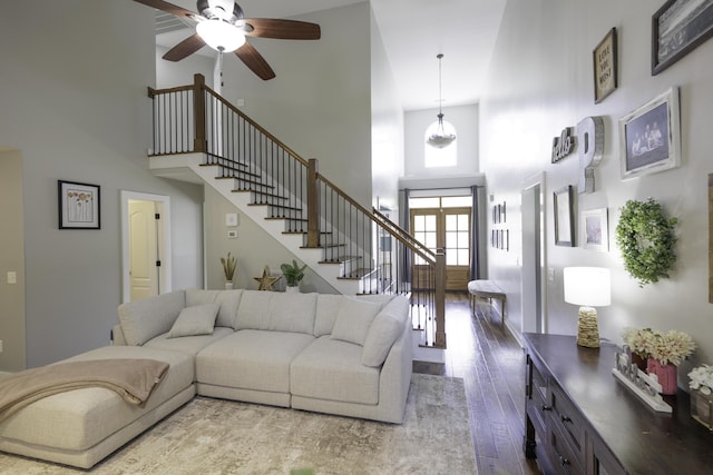 5611 Caney Ridge Cir, Ooltewah, TN 37363 - living area featuring a towering ceiling, stairway, wood-type flooring, and a ceiling fan