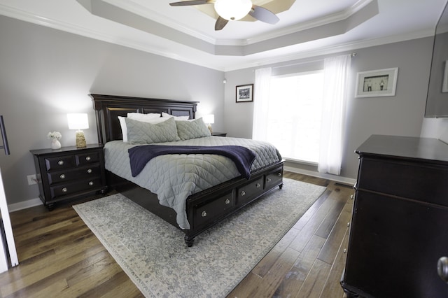 5611 Caney Ridge Cir, Ooltewah, TN 37363 - bedroom with a tray ceiling, dark wood finished floors, ornamental molding, baseboards, and ceiling fan