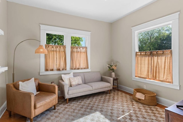 709 S Holly St, Chattanooga, TN 37404 - living area with healthy amount of natural light, baseboards, and wood finished floors