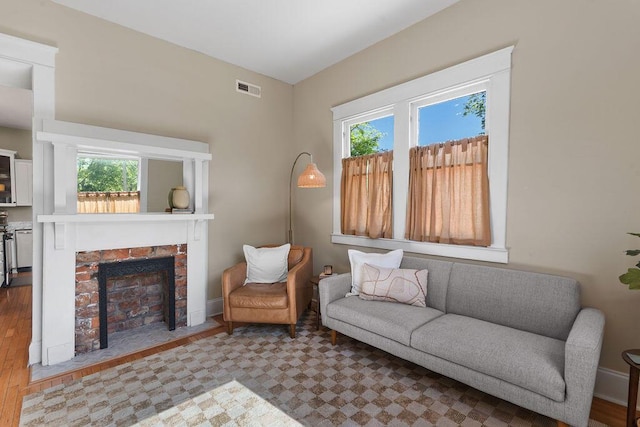 709 S Holly St, Chattanooga, TN 37404 - living room featuring healthy amount of natural light, a fireplace, and baseboards