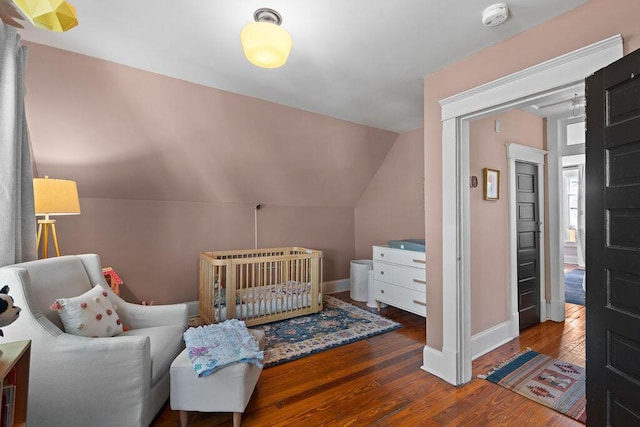 709 S Holly St, Chattanooga, TN 37404 - bedroom featuring hardwood / wood-style flooring, baseboards, and lofted ceiling