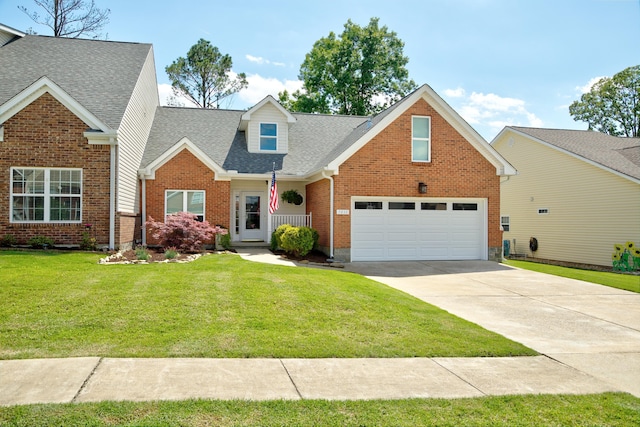 7830 Legacy Park Ct, Chattanooga, TN 37421 - traditional-style house with driveway, a shingled roof, a front lawn, brick siding, and a garage