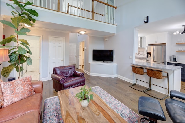 7830 Legacy Park Ct, Chattanooga, TN 37421 - living area featuring a high ceiling, wood finished floors, baseboards, and crown molding
