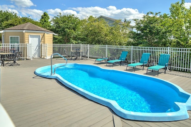 7830 Legacy Park Ct, Chattanooga, TN 37421 - view of swimming pool with a wooden deck, an outdoor structure, and view of scattered trees