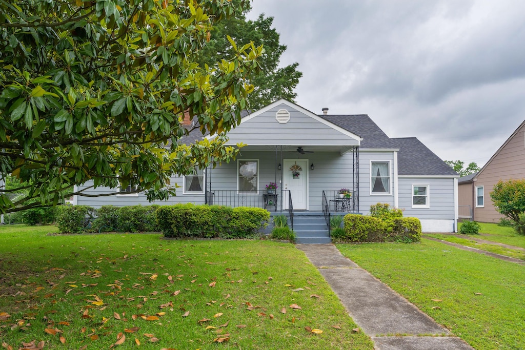 509 Notre Dame Ave, Chattanooga, TN 37412 - bungalow featuring covered porch, a front lawn, and a shingled roof