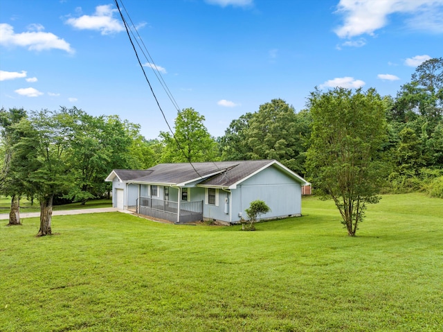 2126 Millard Rd, Soddy Daisy, TN 37379 - view of front of home with a front yard, driveway, an attached garage, and covered porch