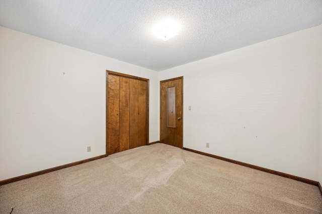 2126 Millard Rd, Soddy Daisy, TN 37379 - spare room featuring light colored carpet, baseboards, and a textured ceiling