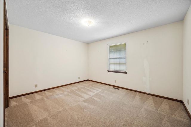 2126 Millard Rd, Soddy Daisy, TN 37379 - unfurnished room with light carpet, baseboards, and a textured ceiling