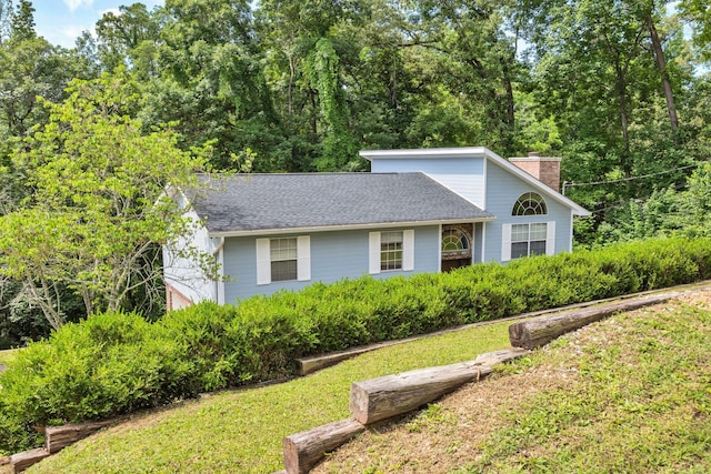 216 Longview Dr, Rossville, GA 30741 - view of front of house featuring a chimney, a front yard, and roof with shingles