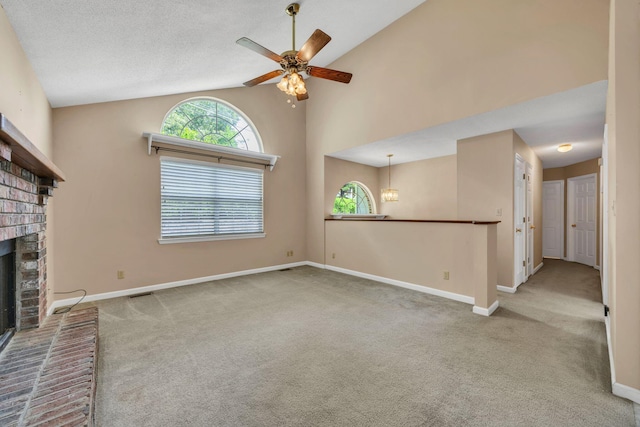 216 Longview Dr, Rossville, GA 30741 - unfurnished living room featuring carpet flooring, a brick fireplace, a ceiling fan, lofted ceiling, and baseboards