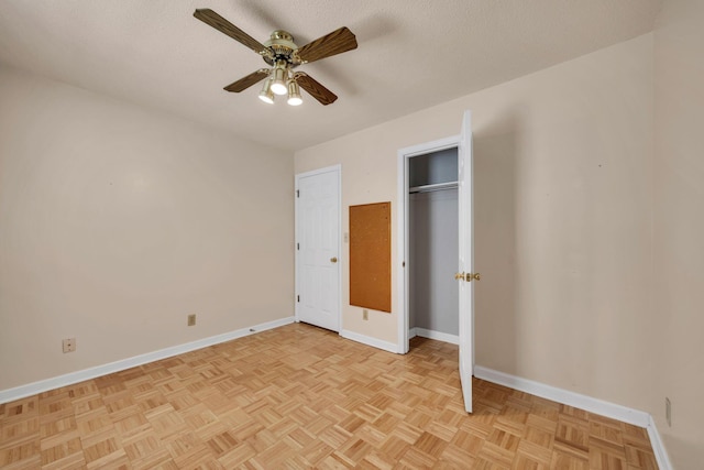 216 Longview Dr, Rossville, GA 30741 - unfurnished bedroom featuring baseboards, a ceiling fan, a closet, and a textured ceiling