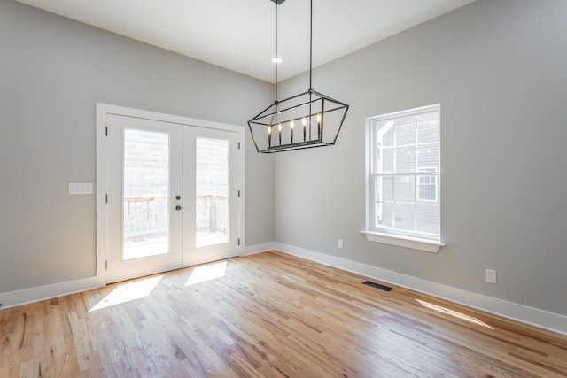 7317 Majestic Hill Dr, Chattanooga, TN 37421 - unfurnished dining area featuring french doors, wood finished floors, baseboards, and a chandelier