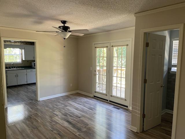 6206 Sagefield Dr, Harrison, TN 37341 - unfurnished room with crown molding, a textured ceiling, dark wood-style floors, ceiling fan, and a sink