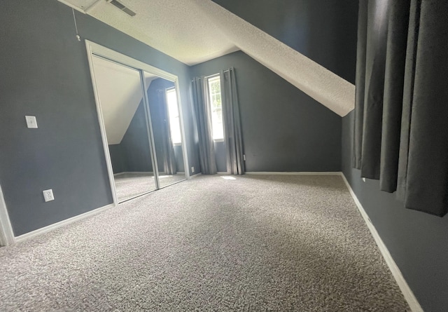 6206 Sagefield Dr, Harrison, TN 37341 - bonus room with carpet, vaulted ceiling, a textured ceiling, baseboards, and attic access