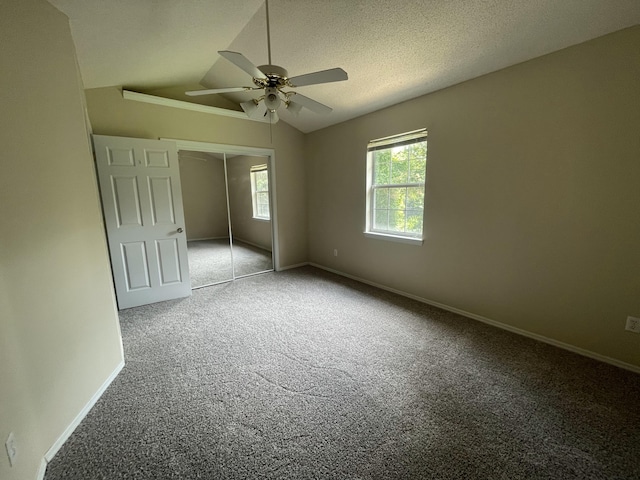 6206 Sagefield Dr, Harrison, TN 37341 - unfurnished bedroom with carpet floors, a closet, vaulted ceiling, baseboards, and ceiling fan