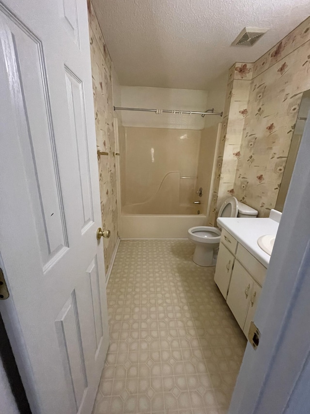 6206 Sagefield Dr, Harrison, TN 37341 - full bathroom featuring toilet, wallpapered walls, vanity, a textured ceiling, and tile patterned floors