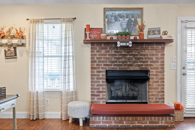 93 Pepper Corn Ln, Rossville, GA 30741 - detailed view of wood finished floors, a brick fireplace, and baseboards