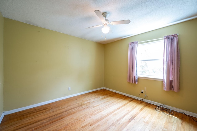1002 Gillespie Rd, Chattanooga, TN 37411 - unfurnished room featuring wood finished floors, a textured ceiling, and a ceiling fan