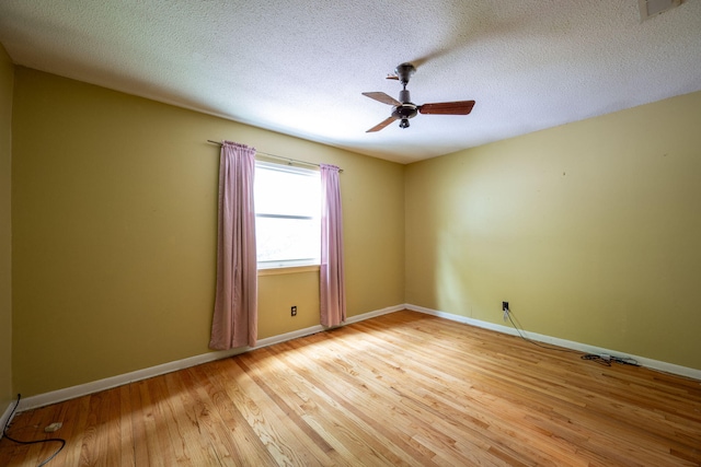 1002 Gillespie Rd, Chattanooga, TN 37411 - empty room with ceiling fan, light wood finished floors, and a textured ceiling
