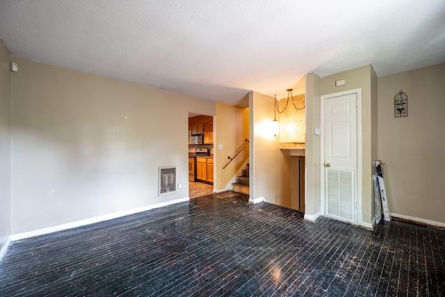 1002 Gillespie Rd, Chattanooga, TN 37411 - spare room featuring baseboards and stairs