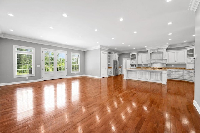 5820 Trion Teloga Rd, Summerville, GA 30747 - unfurnished living room with plenty of natural light, wood finished floors, baseboards, recessed lighting, and ornamental molding