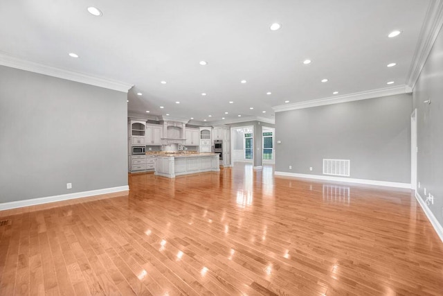 5820 Trion Teloga Rd, Summerville, GA 30747 - unfurnished living room with ornamental molding, baseboards, recessed lighting, and light wood-style floors