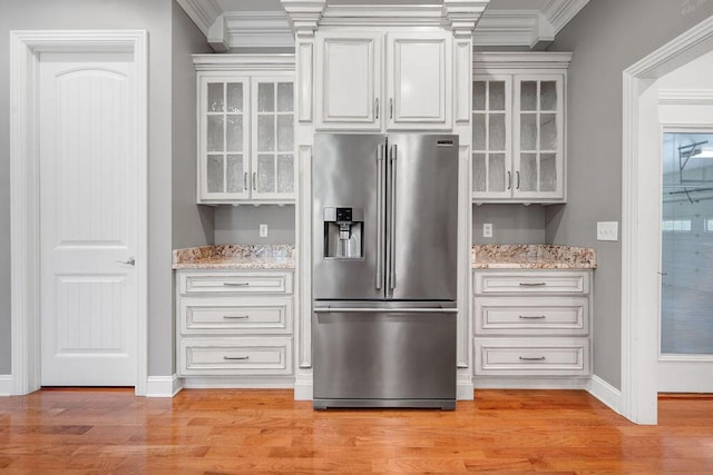 5820 Trion Teloga Rd, Summerville, GA 30747 - kitchen featuring high quality fridge, glass insert cabinets, baseboards, light wood-type flooring, and light stone counters