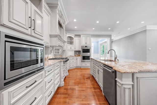 5820 Trion Teloga Rd, Summerville, GA 30747 - kitchen with stainless steel appliances, a sink, ornamental molding, white cabinets, and light wood finished floors