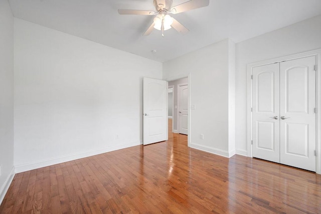 5820 Trion Teloga Rd, Summerville, GA 30747 - unfurnished bedroom with wood finished floors, baseboards, a closet, and a ceiling fan